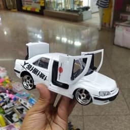 اسباب بازی ماشین پژو پارس شوتی پنوماتیک کف خواب سفید — تصویر ۵