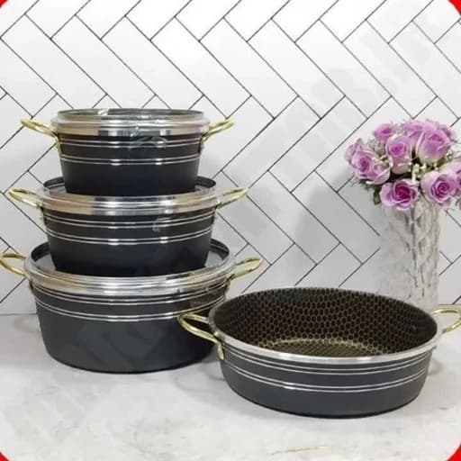 سرویس قابلمه 7پارچع رنگ مشکی خط دار جنس گرانیتی دسته طلایی داخل مشکی ساده سایز بزرگ مناسب برای پخت یک تا 12