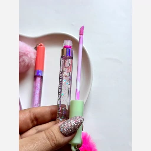 برق لب حرارتی فانتزی کیوت گوگولی پینترستی پوم پوم دار ابرسان و مرطوب کننده لبها منگوله آویز پشمی — تصویر ۵