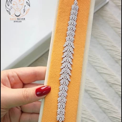 دستبند نقره زنانه نگین کاری شده طرح پرکار 925 عیار با روکش طلای سفید همراه فاکتور 21 — تصویر ۲