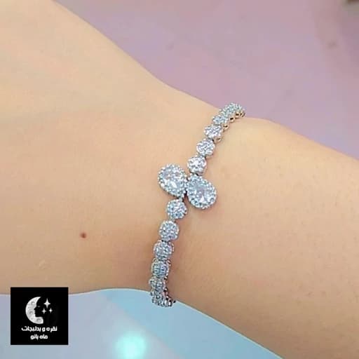 دستبند نقره زنانه فلاور اشکی باقفل آسانسوری عیار 925 و آبکاری طلا سفید — تصویر ۲