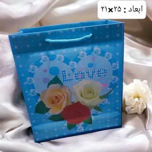 ساک دستی پلاستیکی آبی طرح گل 21×25