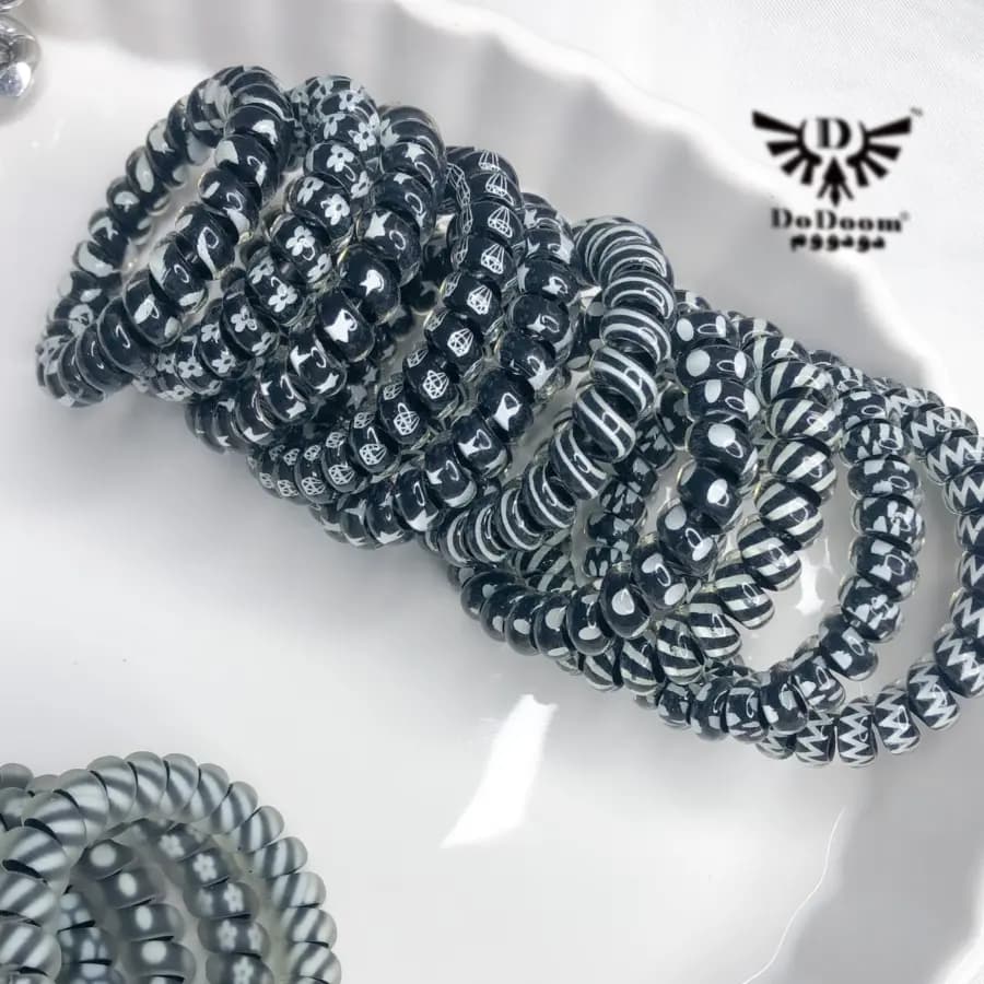 کش مو سیم تلفنی طرحدار مشکی K65 — تصویر ۲