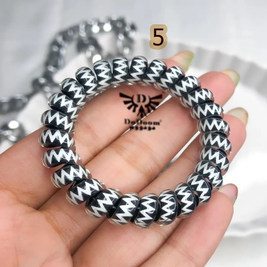 کش مو سیم تلفنی طرحدار مشکی K65 — تصویر ۷
