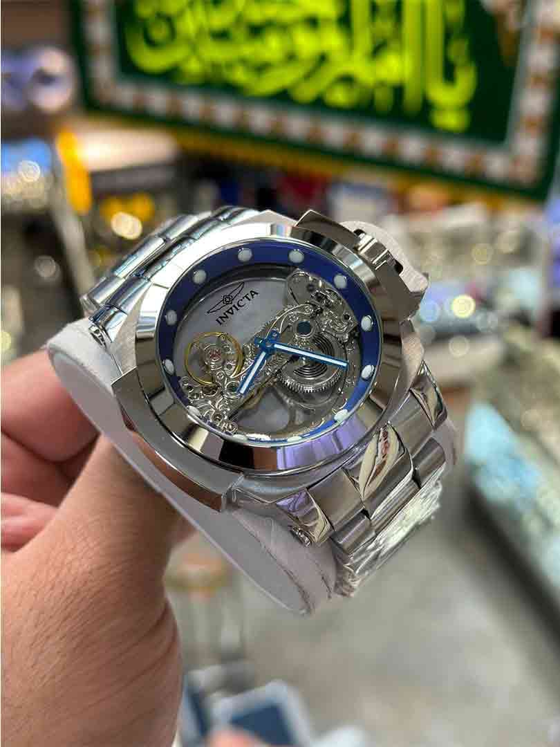 ساعت مچی مردانه اینویکتا مدل گوست ریزرونقره ای اتومات بند فلزی Invicta Automatico Ghost-S 2024