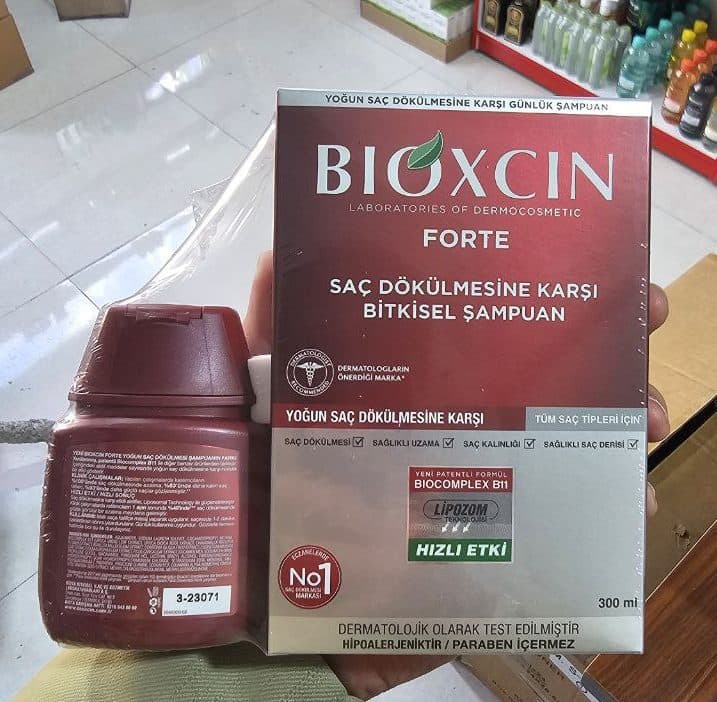 پک شامپو گیاهی ضد ریزش مو بیوکسین سری Forte مناسب انواع مو 300 + 100 میل — تصویر ۵