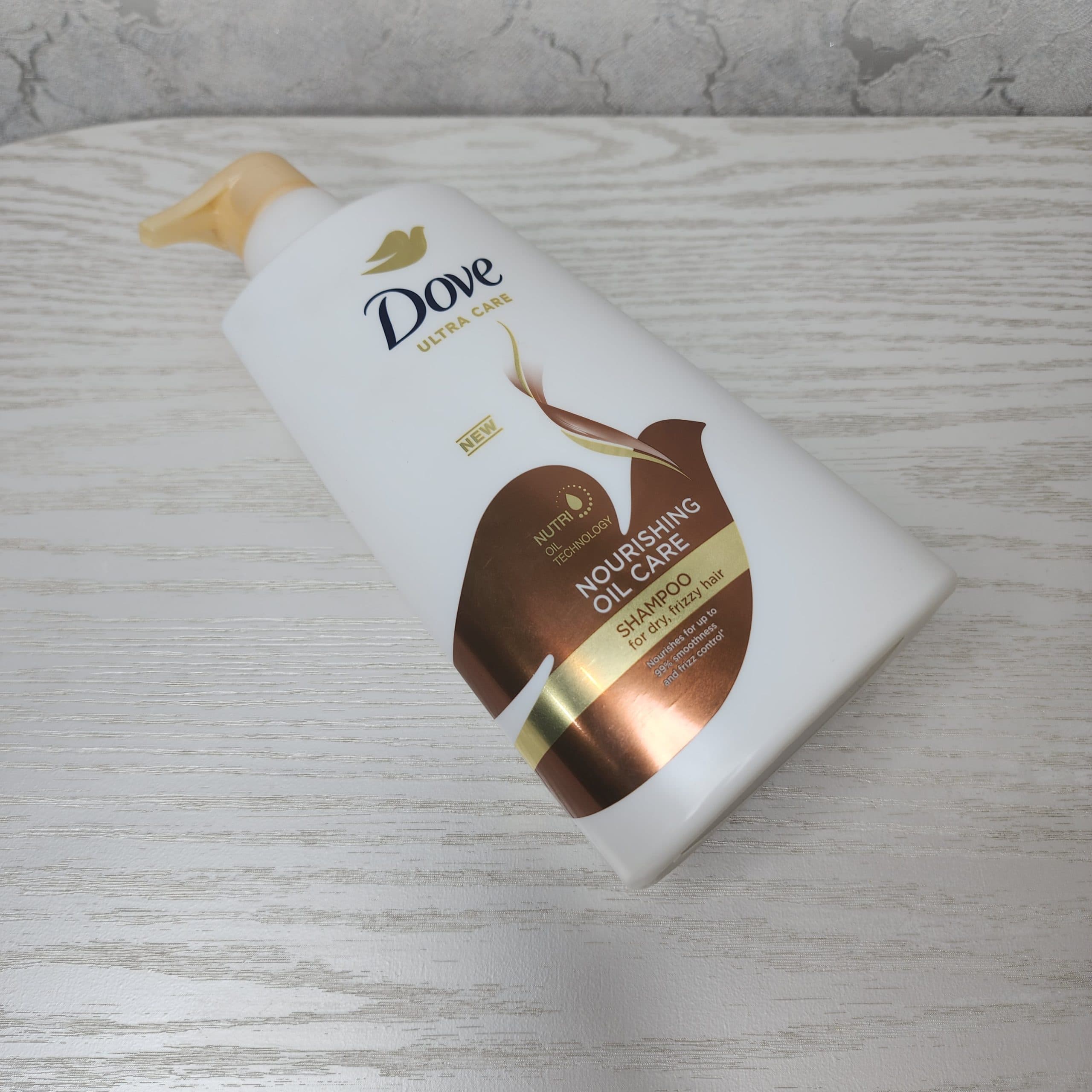 شامپو ultra care مدل nourishing oil care داو برای مو های خشک — تصویر ۵
