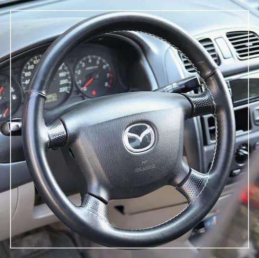 روکش فرمان دوختنی مزدا 323 Mazda برند R-506) ECCCO)