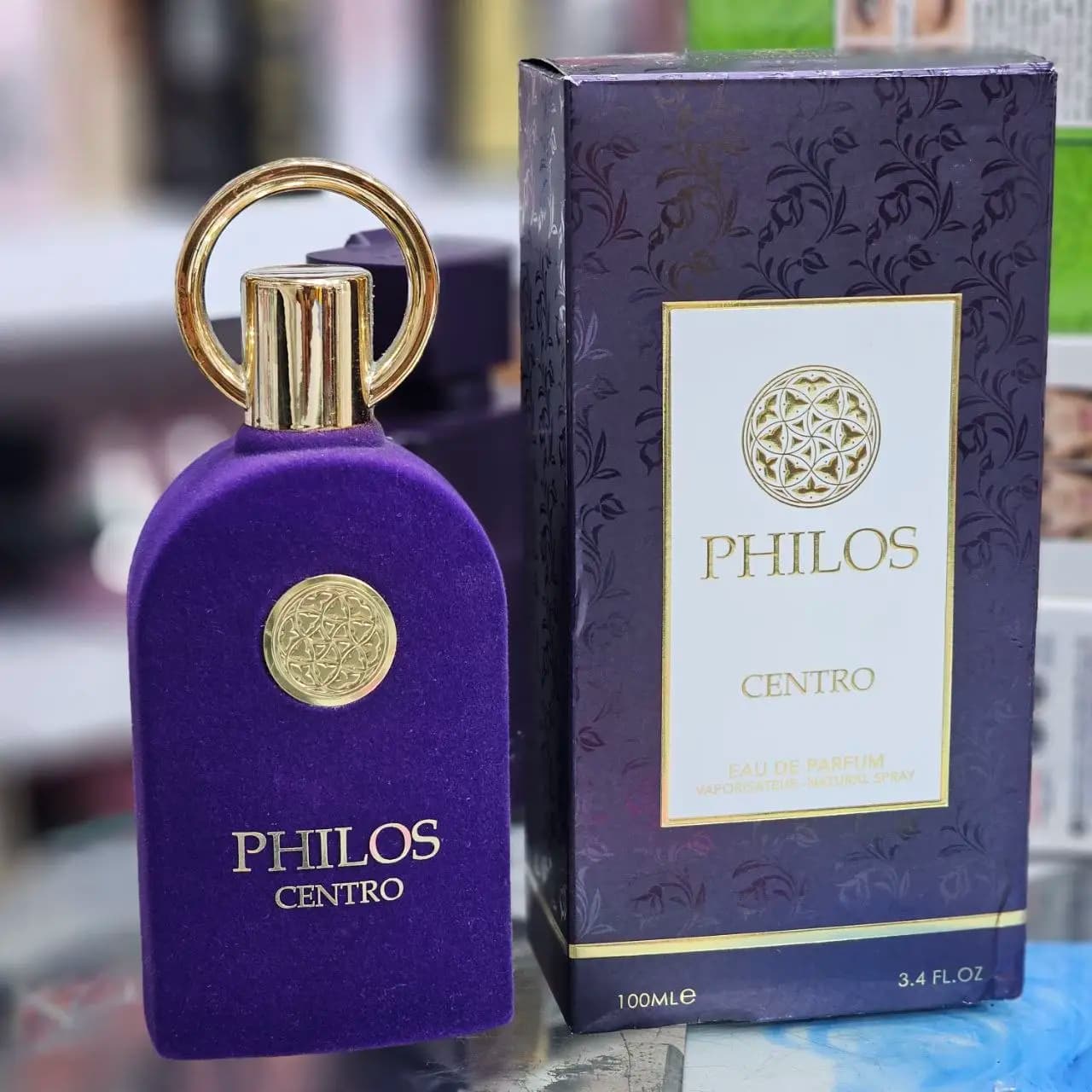 ادکلن فیلوس سنترو (PHILOS CENTRO) ادو پرفیوم عطر یونیسکس با بطری مخملی بنفش و جعبه مشکی حجم 100 میل — تصویر ۶