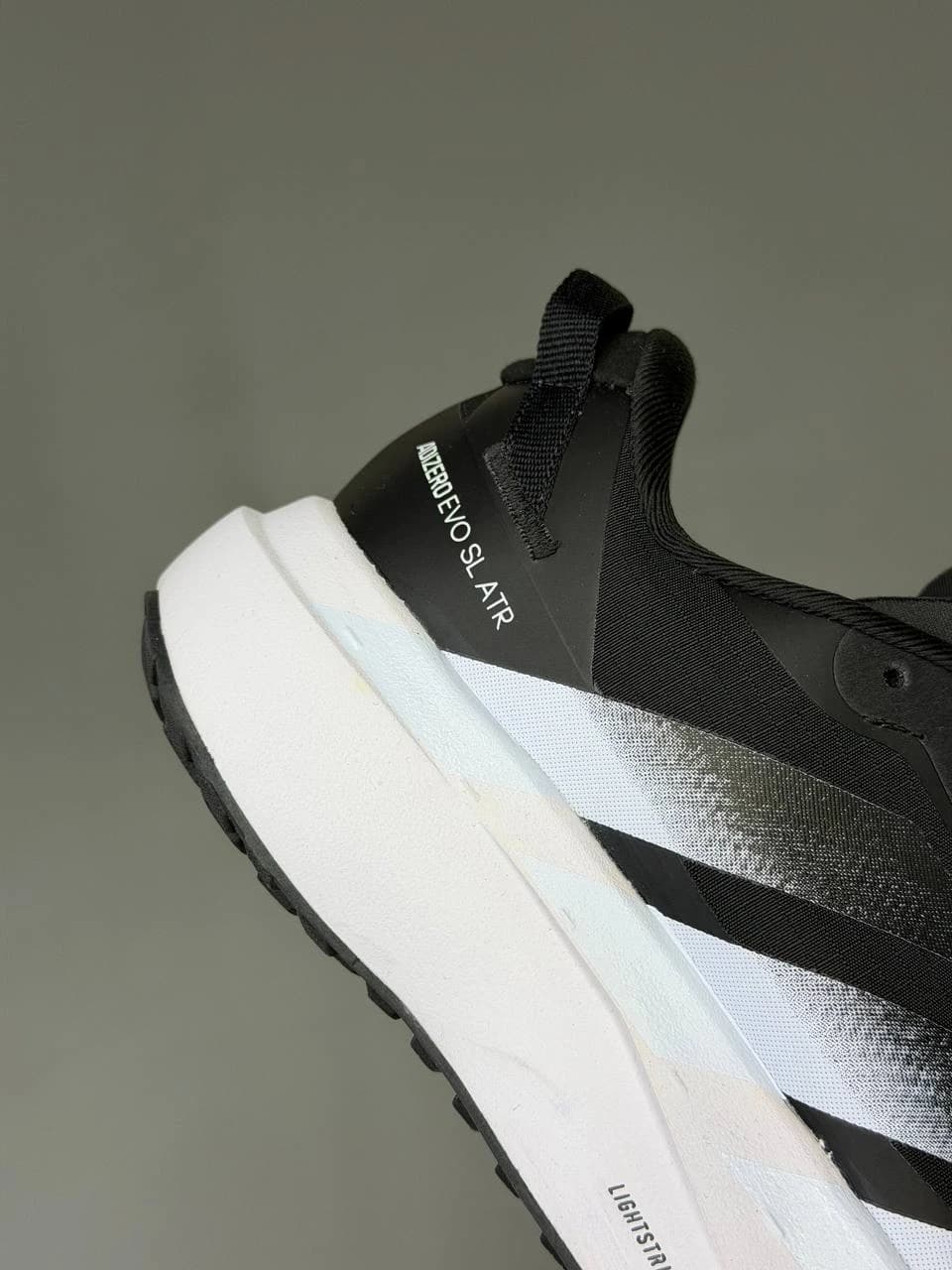 کتونی آدیداس آدی زیرو اوو اس ال ای تی آر مشکی سفید Adidas Adizero Evo Sl ATR Black White — تصویر ۱۲