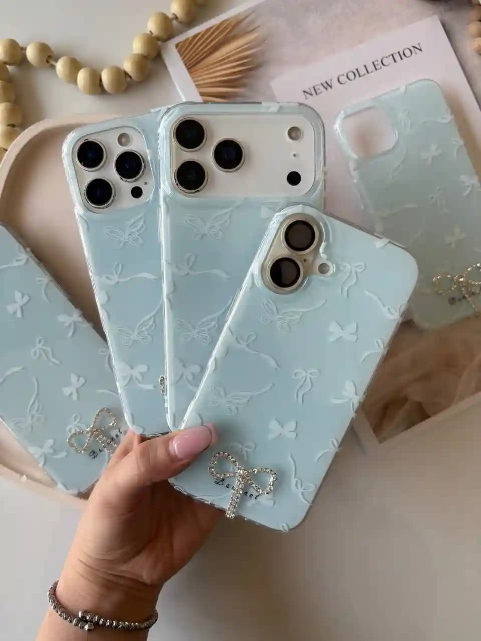 قاب پاپیون آبی پاستیلی منگوله ای Iphone 13 — تصویر ۲