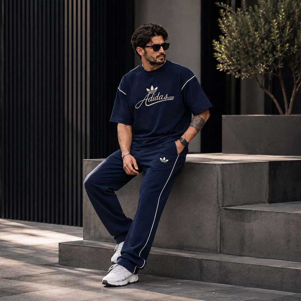 ست تیشرت و شلوار مردانه طرح adidas خطدار | رنگ سورمه ای — تصویر ۲