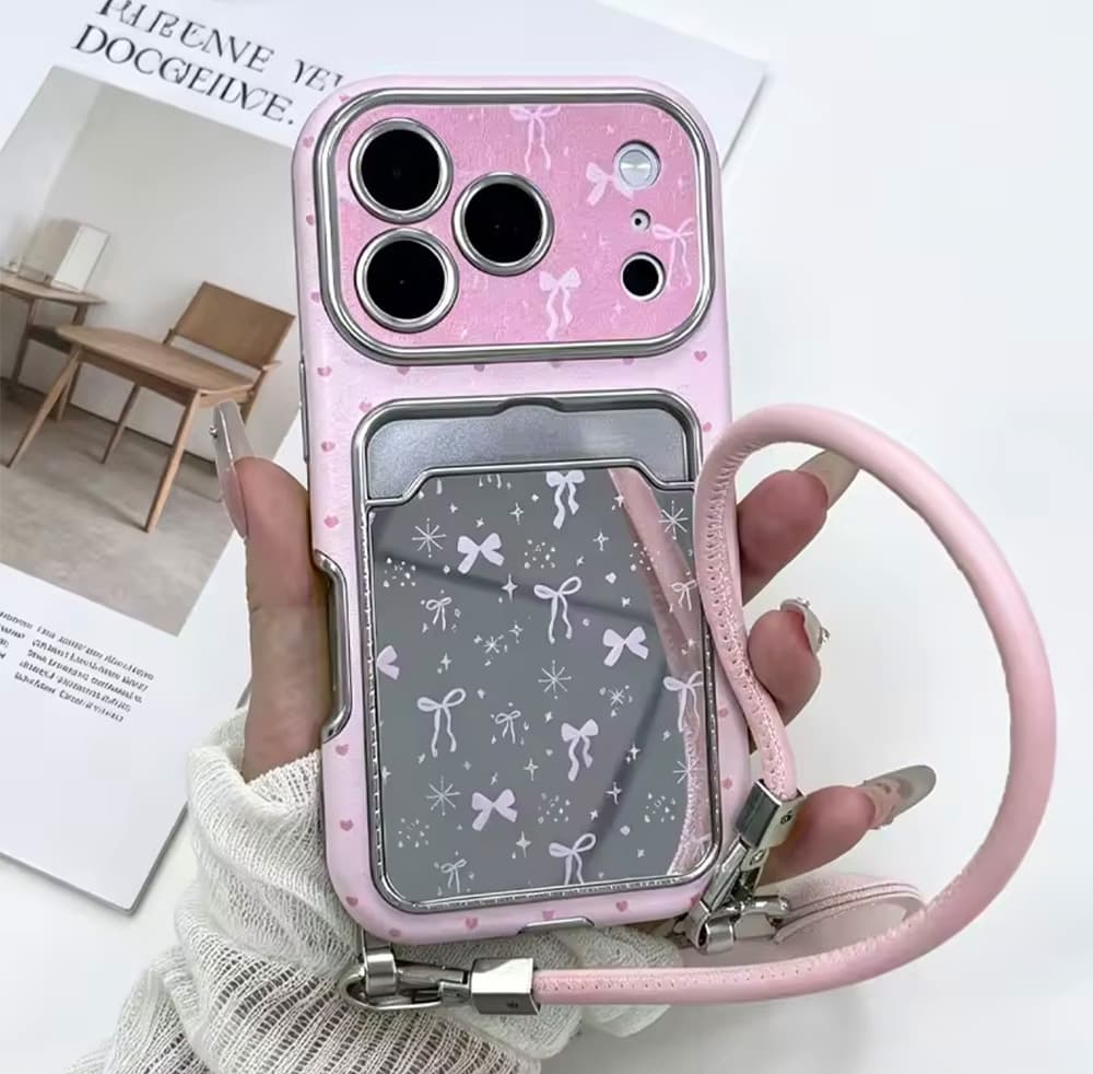 قاب جاکارتی آیینه ای Pink Ribbon همراه با بند دستی کد TRD مناسب برای گوشی موبایل آیفون Apple iPhone 13 / 13 Pro / 13 Pro Max / 14 Pro Max / 15 Pro Max / 16 / 16 Pro Max / 17 / 17 Pro / 17 Pro Max