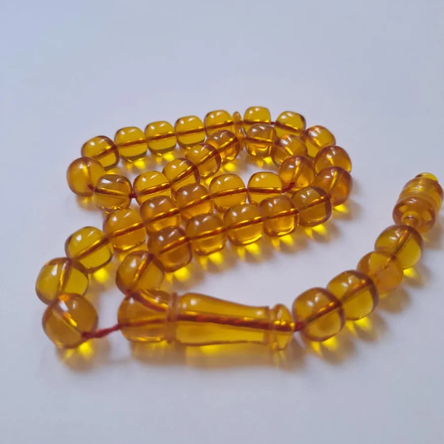 تسبیح سندلوس 33 دانه بودار تراش استوانه‌ای خوشرنگ قپاندار شماره 11 کد 1391 آقابزرگ — تصویر ۶