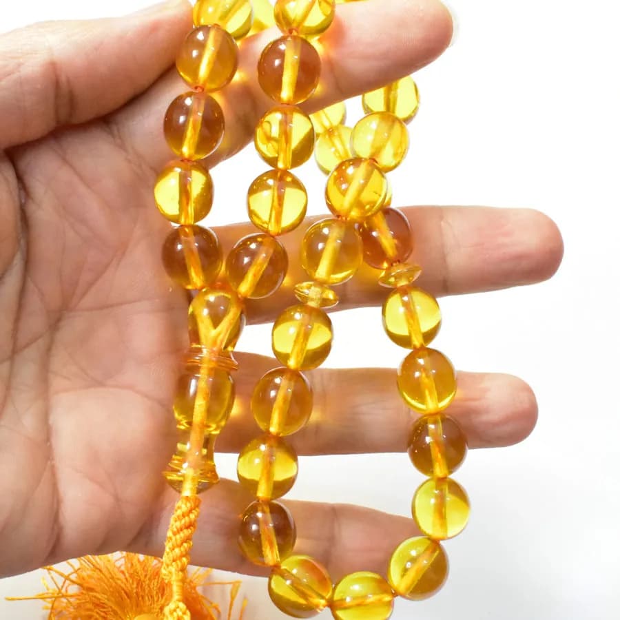 تسبیح سندلوس 33 دانه اصل کد 1328 بودار تراش بیضی زرد سایز 13 آقابزرگ — تصویر ۴