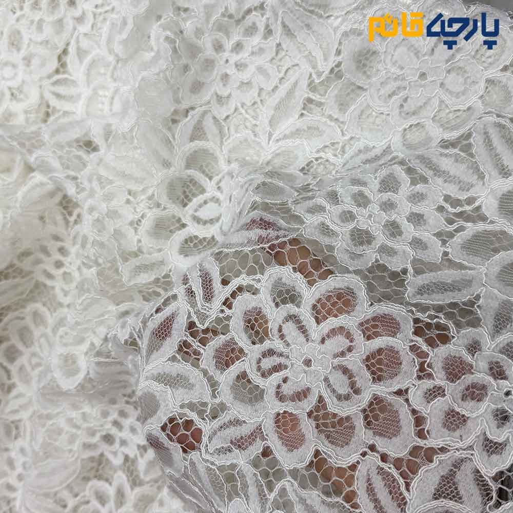 پارچه مجلسی دانتل رنگ سفید طرح گل متوسط برجسته عرض ۱۵۰ کد 12495 — تصویر ۳
