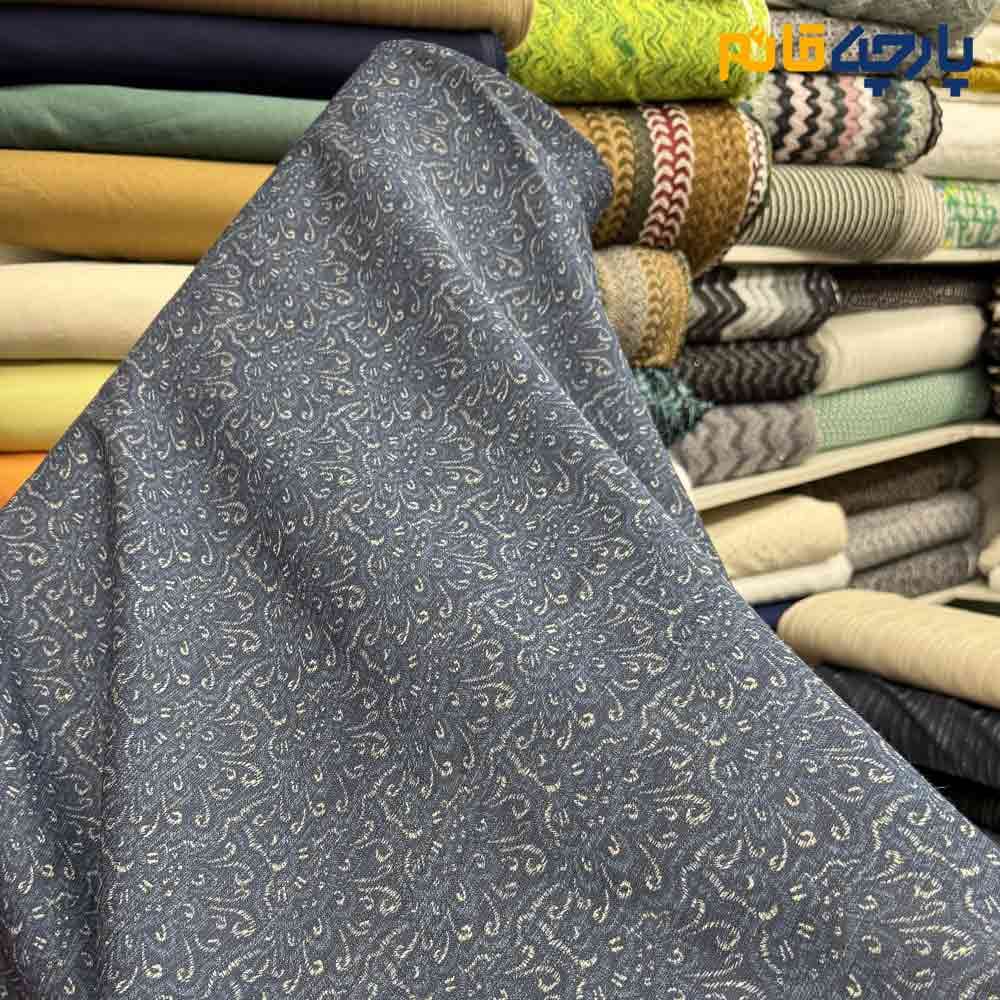پارچه لینن سانتون طرحدارزمینه سرمه ای طرح کرم عرض ۱۵۰ کد 12371