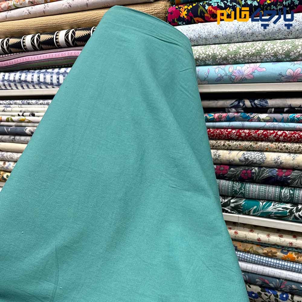 پارچه بهاره تابستانه لینن سفارشی ساده رنگ فیروزه ای متوسط(بنتون) عرض ۱۵۰ کد11308