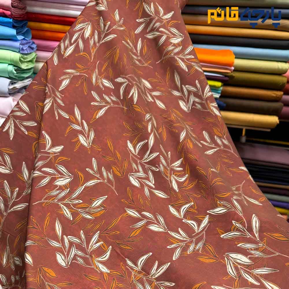 پارچه بهاره تابستانه سیلک نخ طرحدار زمینه رنگ آجری طرح برگ متوسط کد9906