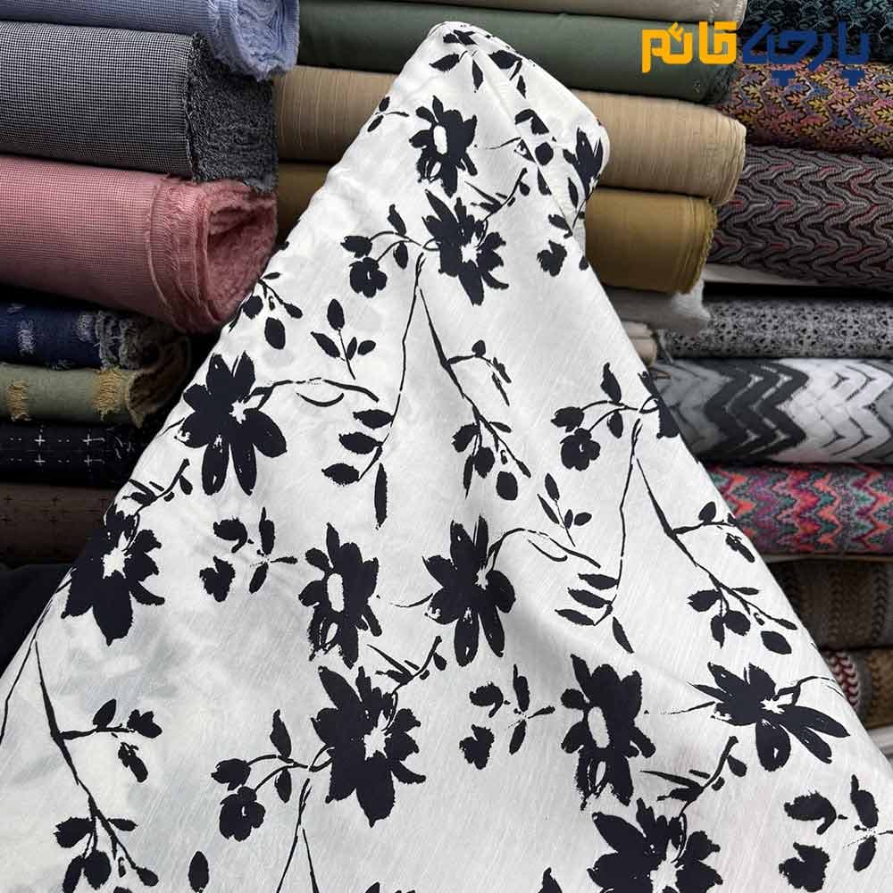 پارچه بهاره تابستانه لینن طرحدار ایتالیایی زمينه سفيد گل مشكي کد9589