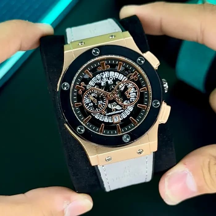 ساعت هابلوت مردانه طلایی مشکی بند طوسی | HUBLOT