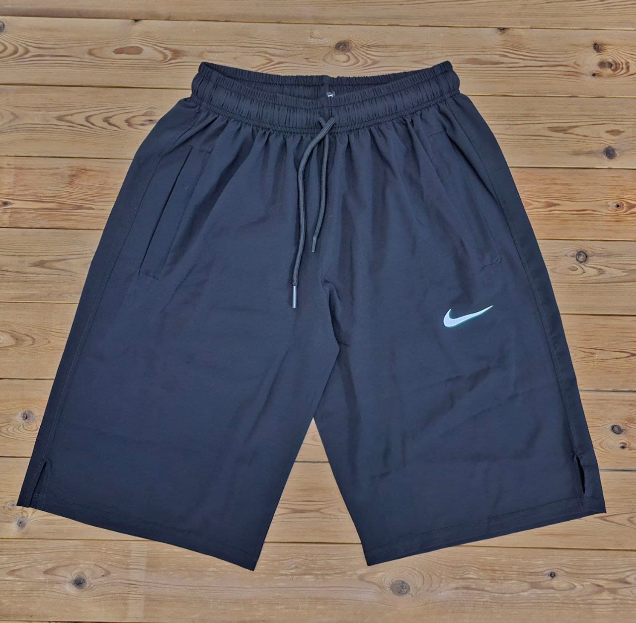 شلوارک ورزشی مردانه بلند 56 سانت مدل NIKE پارچه آیرو کره ای جیب دار سبک و خنک با ضمانت تک رنگ مشکی