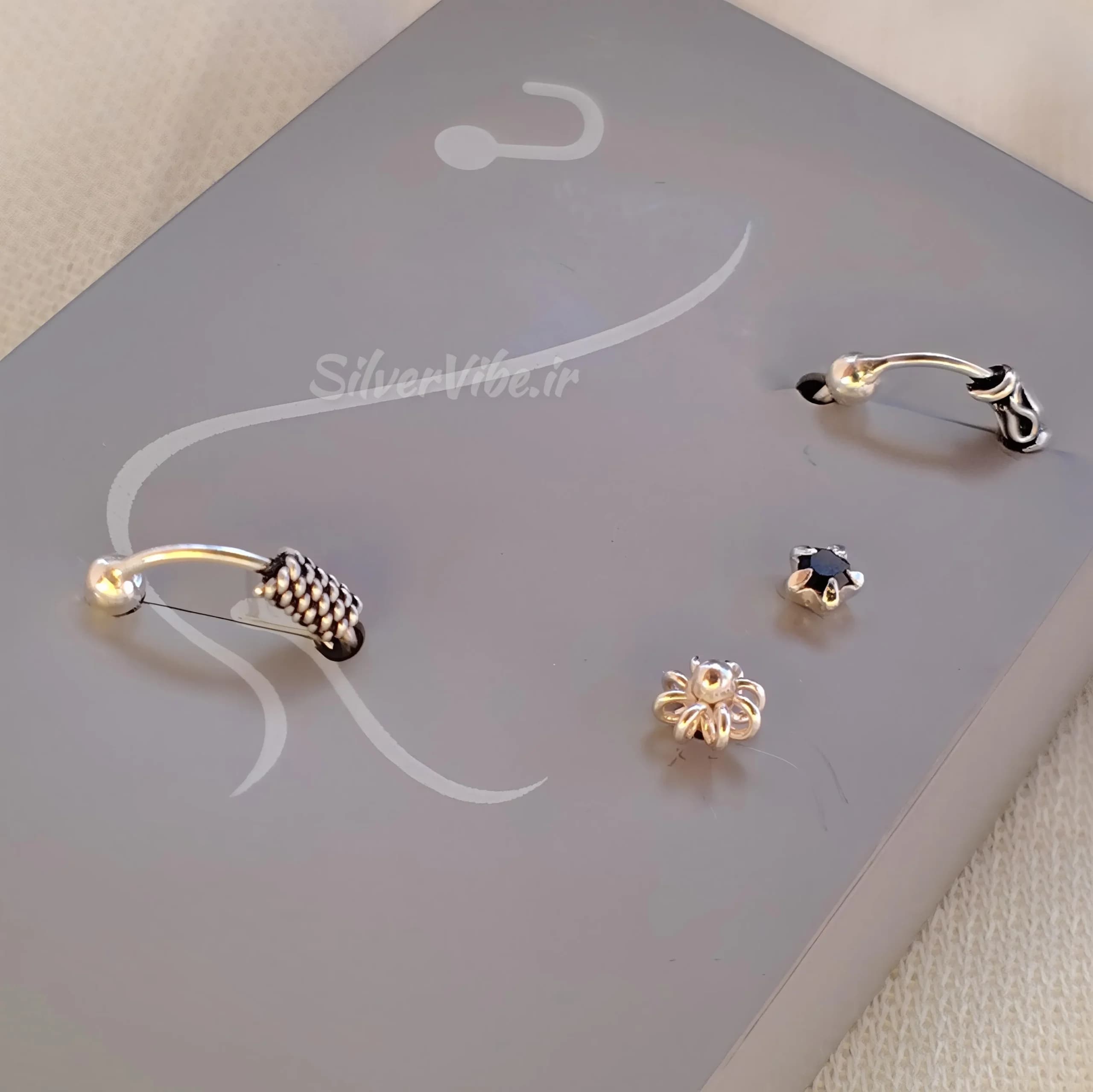 پیرسینگ بینی نقره | ست چهارتایی نگینی و حلقه ای | برند accessories — تصویر ۳