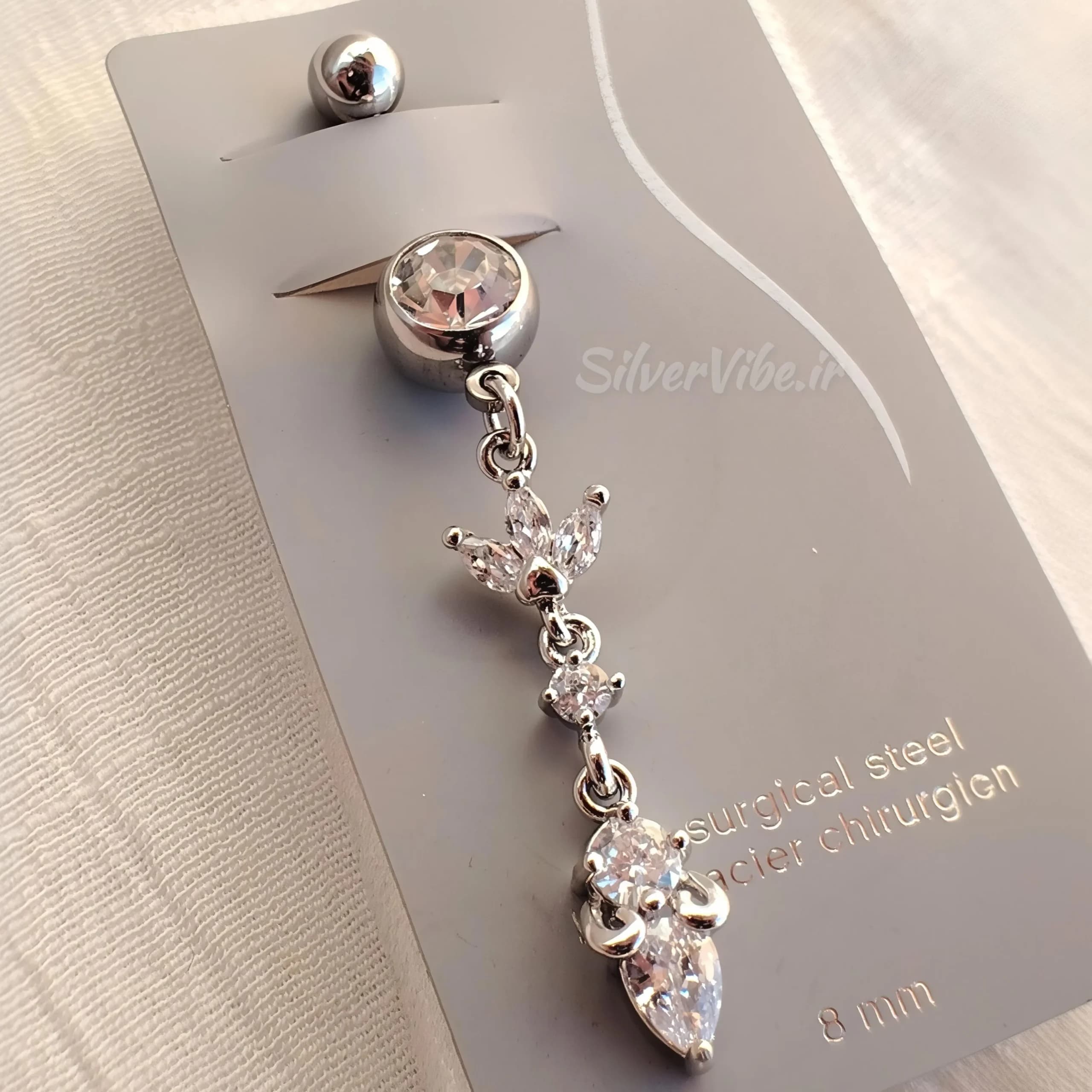 پیرسینگ ناف استیل | آویز بلند طرح برگ نگین دار | برند Accessories — تصویر ۴