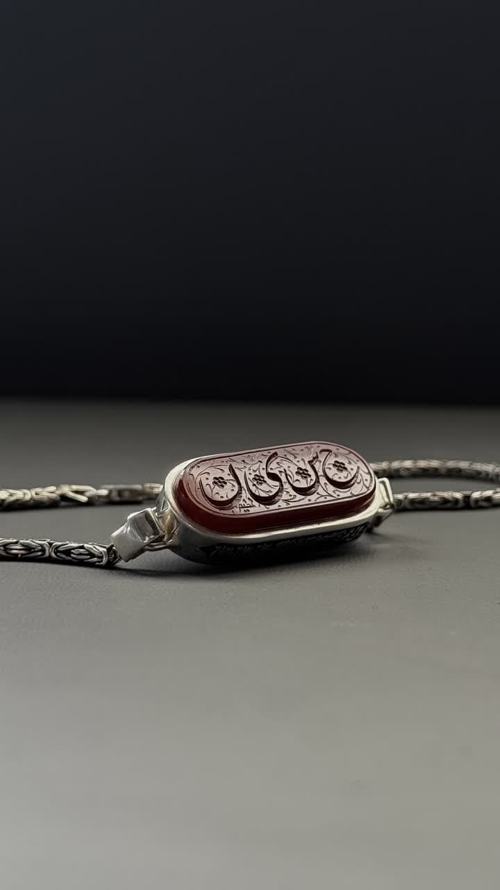دستبند عقیق سرخ با حرز جواد و تربت