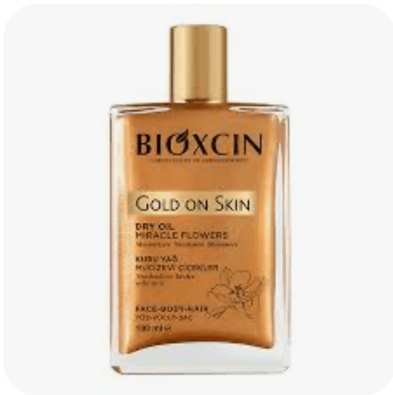 روغن بدن شاین دار بیوکسین مدل gold on skin مناسب برای پوست صورت و بدن و مو 100 میل bioxcin