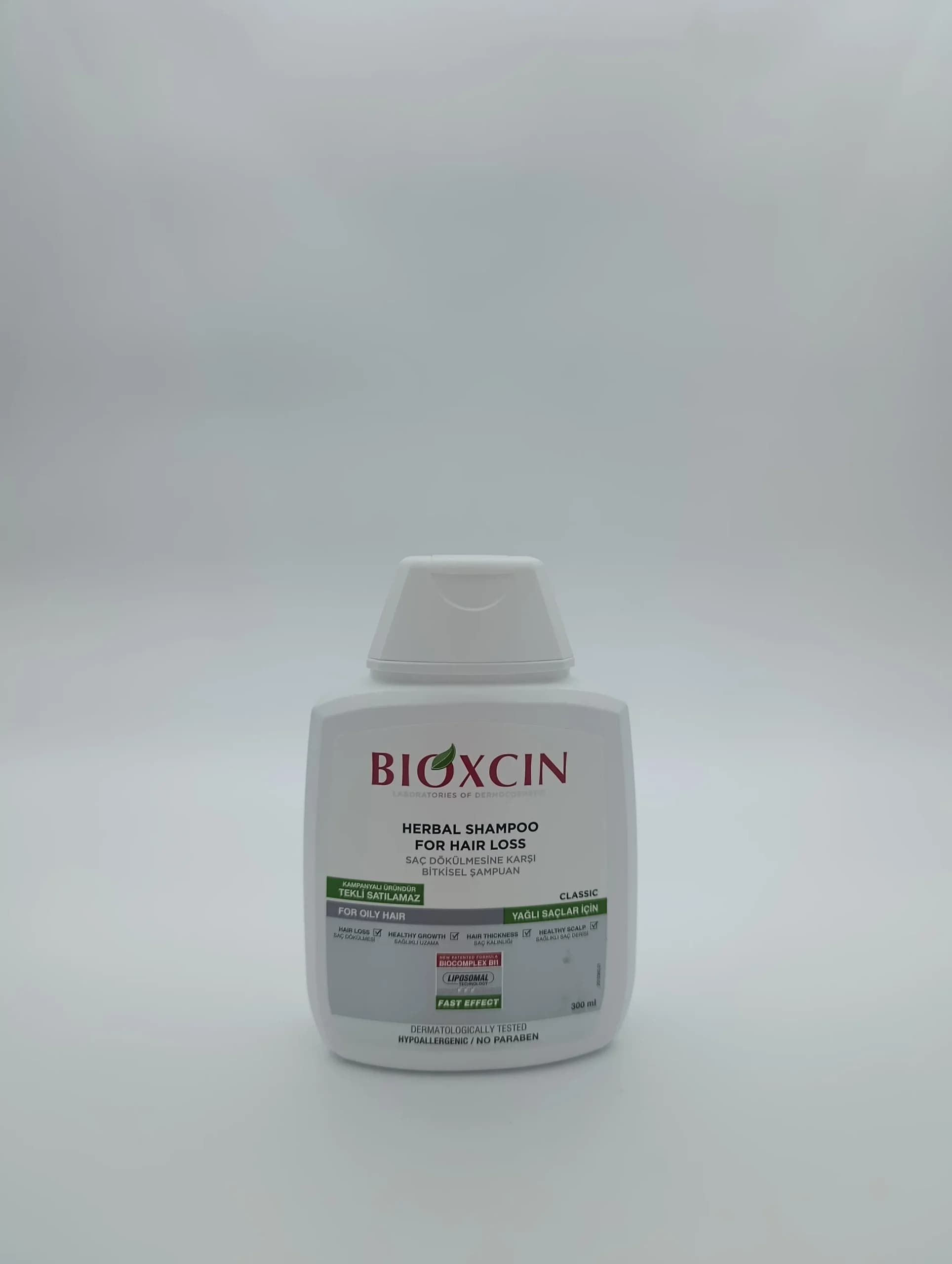 شامپو گیاهی ضد ریزش بیوکسین Bioxcin مدل کلاسیک موهای چرب ۳۰۰ میل | کمک به رویش مجدد مو (اصل)