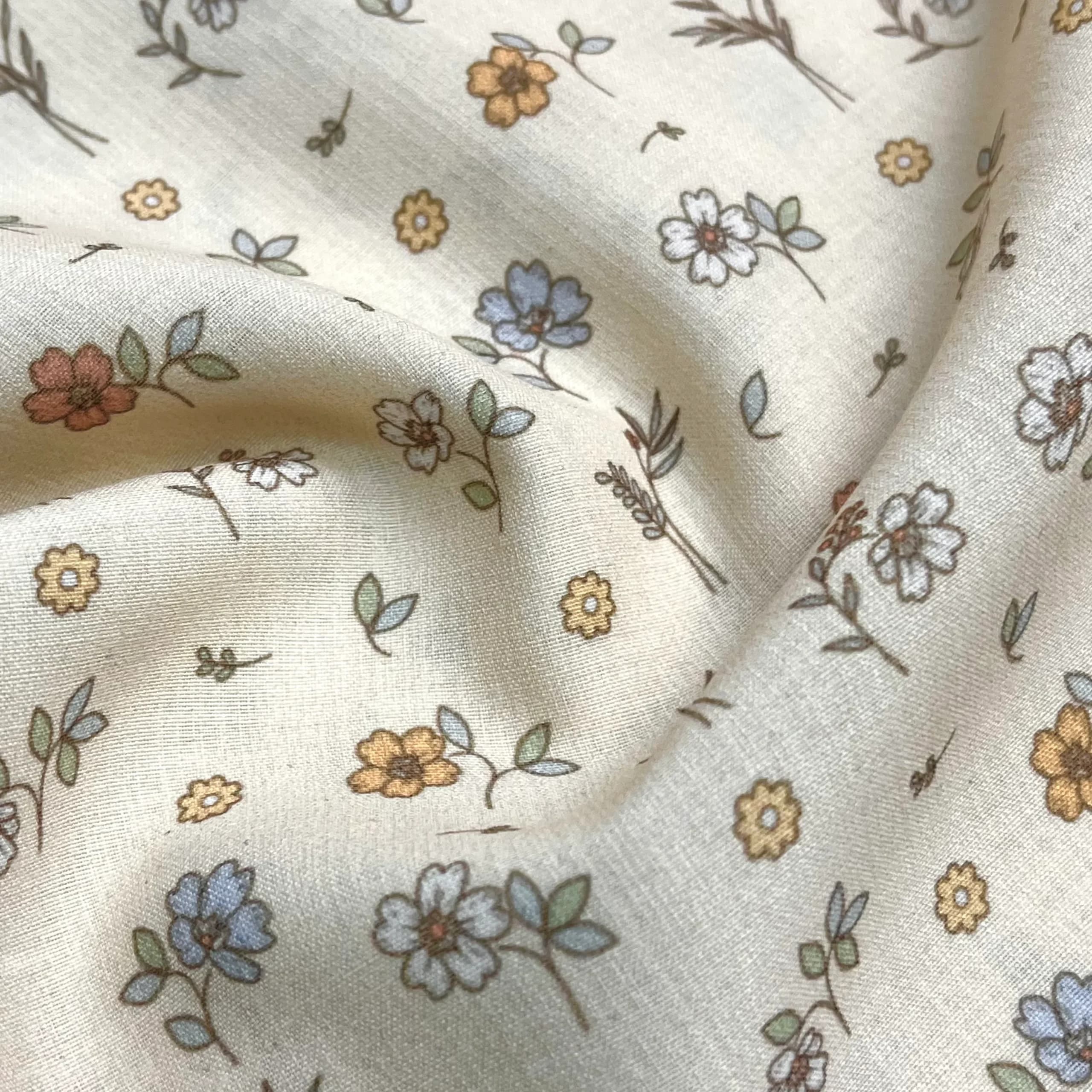 پارچه نخی پنبه‌ای طرح شاخه گل زمینه کرم