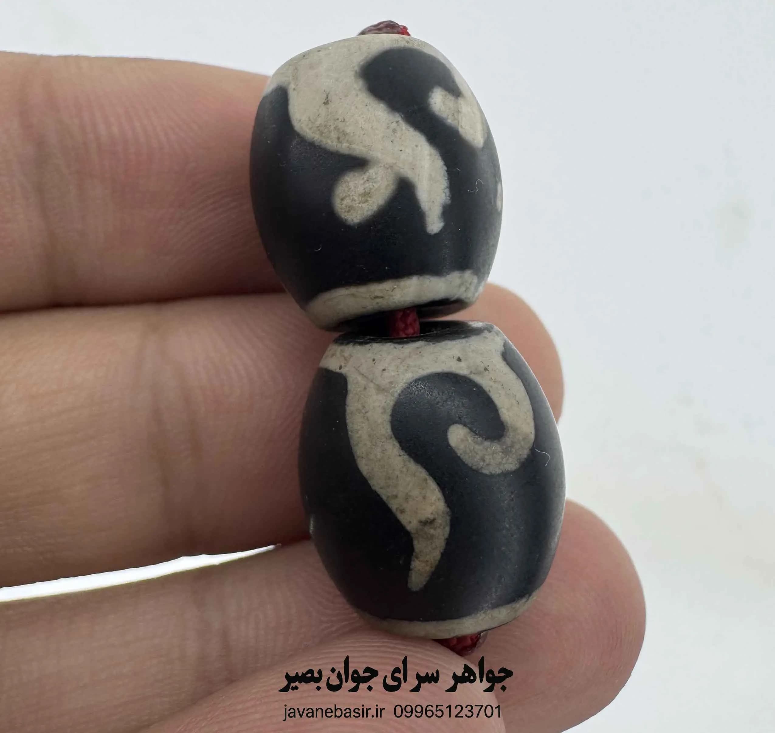 جفت مهره بودایی با نقش هندسی چرخگونه؛ نماد تمرکز و تعادل