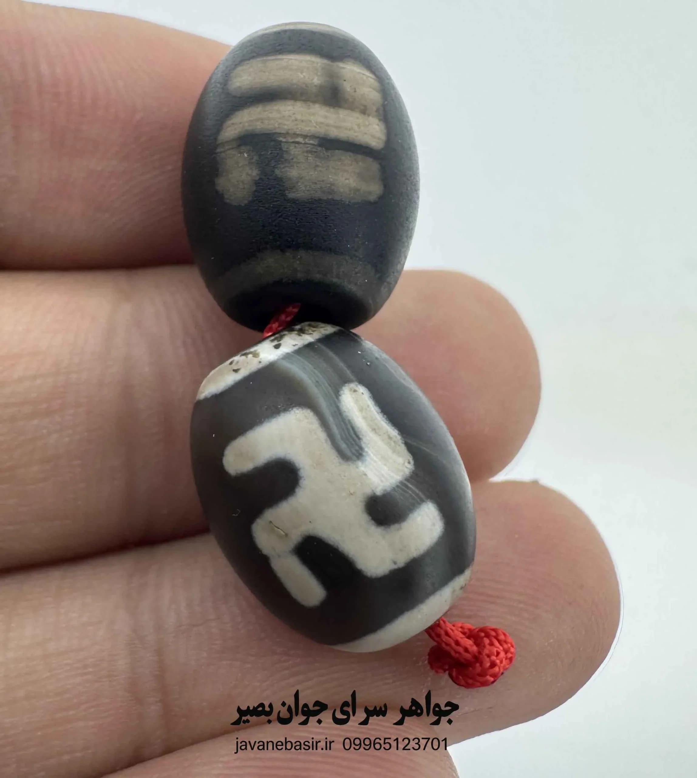 جفت مهره بودایی با نقش دارما چاکرا؛ نماد نظم و چرخش هستی