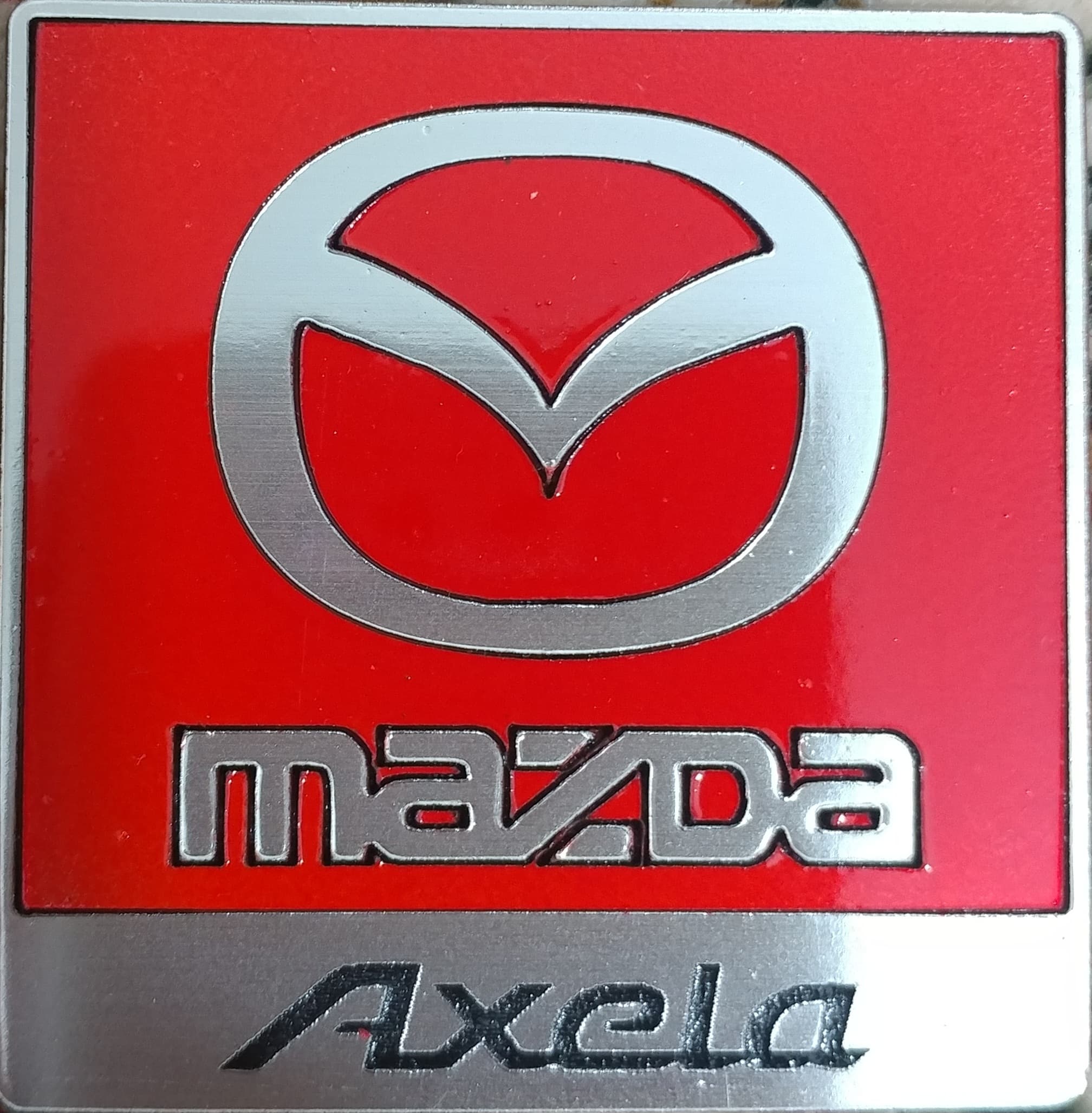آرم مزدا axela