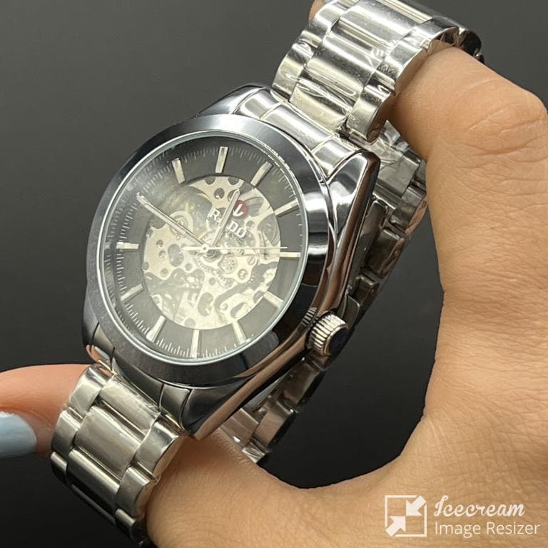 ساعت مردانه رادو اتومات صفحه مشکی قلب باز با بنداستیل نقره ای TISSOT — تصویر ۴