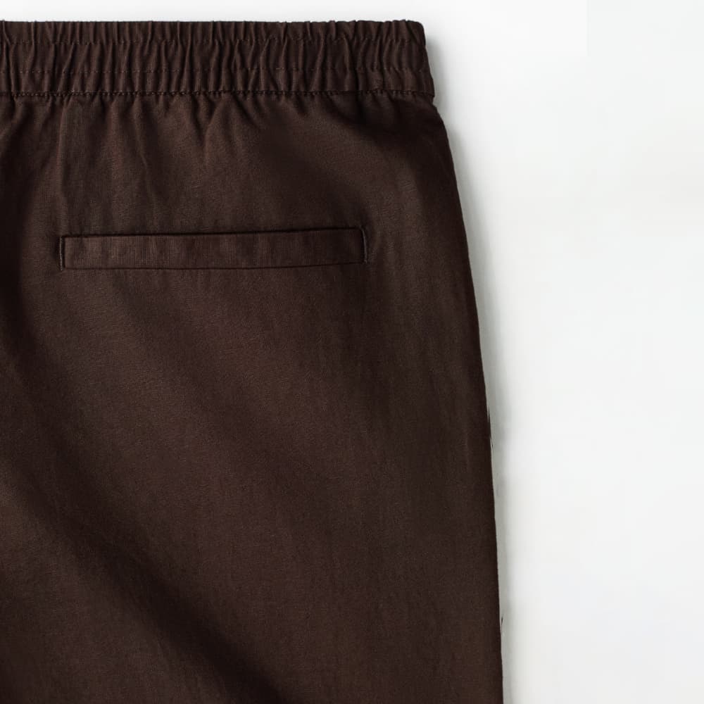 شلوار لینن مردانه نیم بگ خنک و راحت برند H&M – قهوه‌ای — تصویر ۴