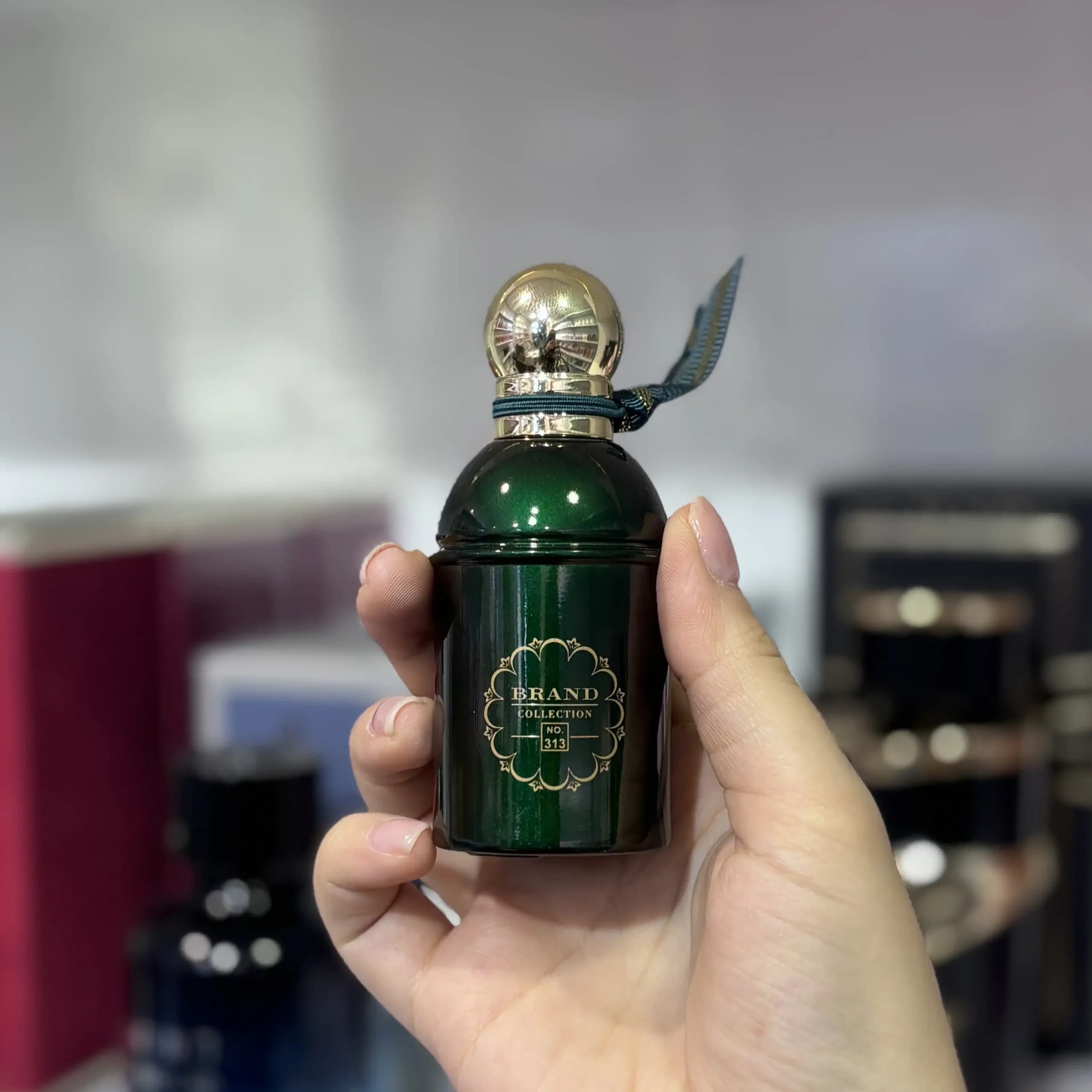 ادکلن 25 میل گرلن عود اسنشیال کد 313 برند کالکشن