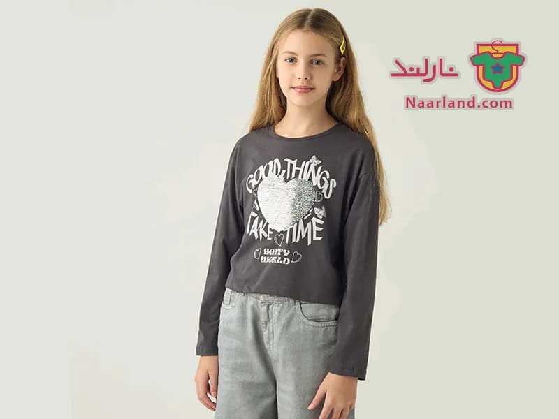 تیشرت کراپ آستین بلند نخی برند Juniors خاکستری طرح پولک برگردان قلب صورتی