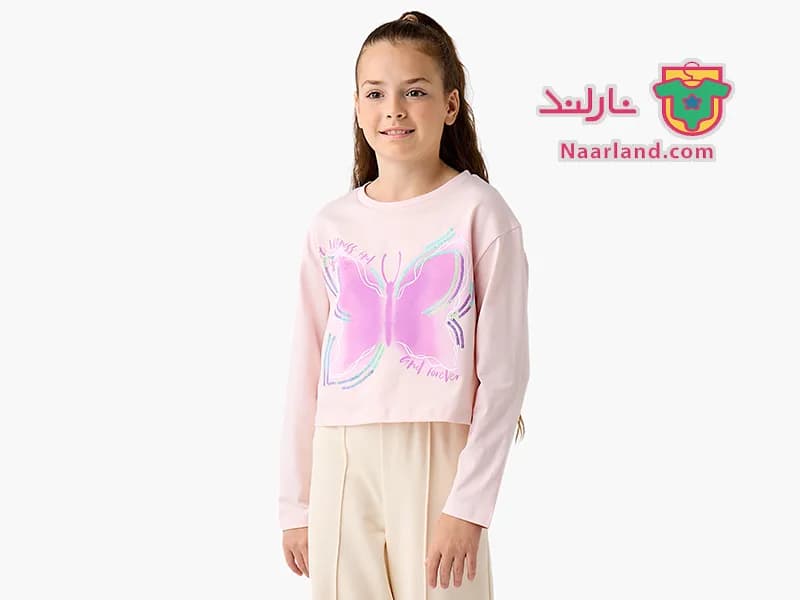 تیشرت کراپ آستین بلند نخی برند Juniors صورتی پولک دار طرح پروانه