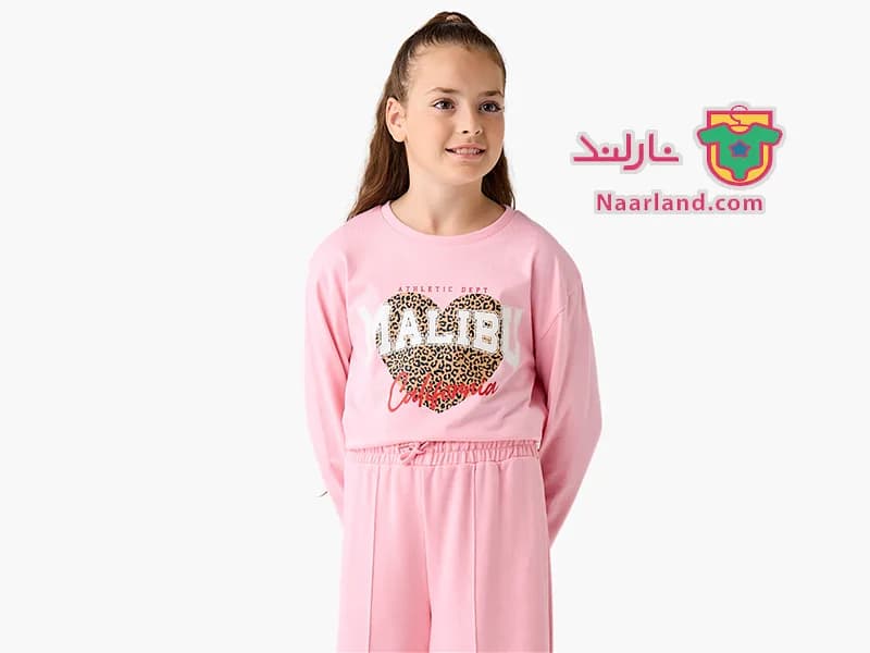 تیشرت کراپ آستین بلند نخی برند Juniors صورتی طرح قلب پلنگی