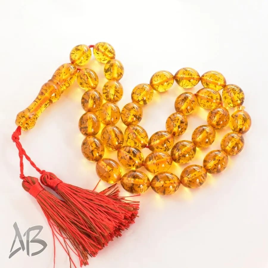 تسبیح کهربای 33 دانه اکلیلی و بسیار زیبا تخم کفتری کد 1161 آقابزرگ — تصویر ۲