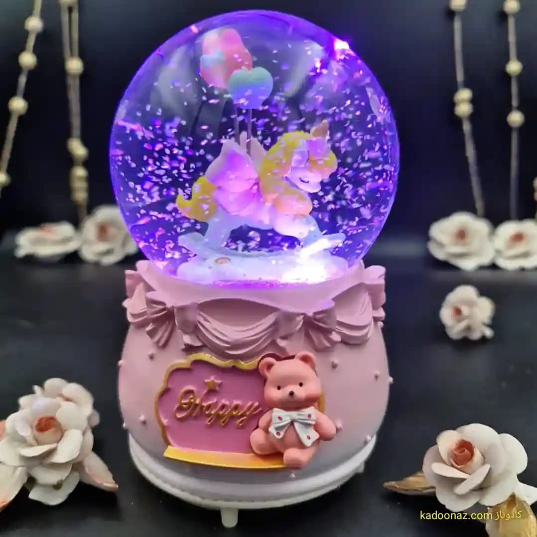 گوی شیشه ای بزرگ موزیکال پمپی برفی با شش طیف نوری طرح اسب تک شاخ Happy رنگ صورتی — تصویر ۲