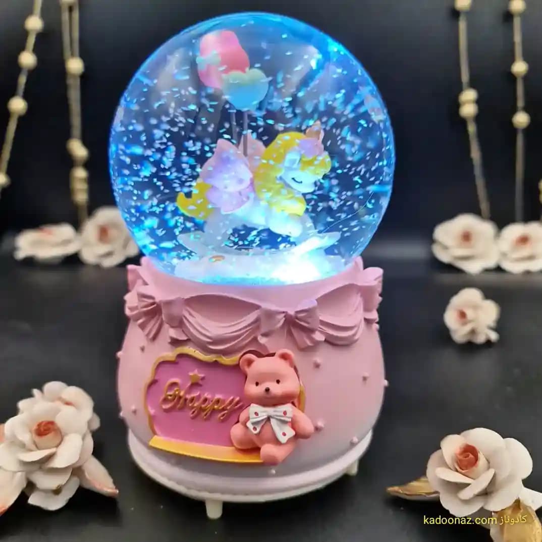 گوی شیشه ای بزرگ موزیکال پمپی برفی با شش طیف نوری طرح اسب تک شاخ Happy رنگ صورتی — تصویر ۵