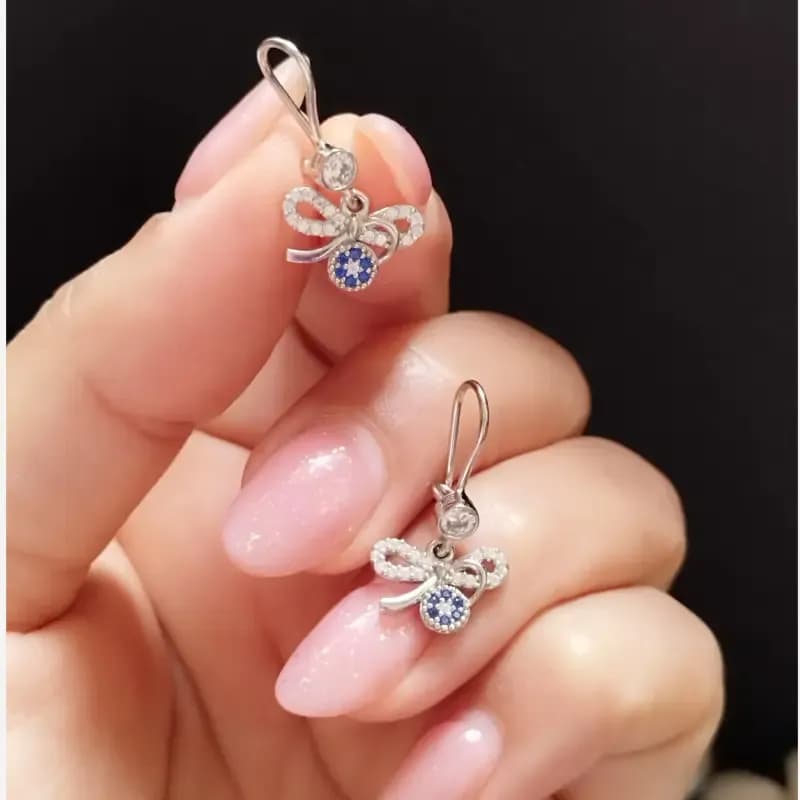 گوشواره نقره زنانه طرح پاپیون و چشم نظر عیار 925 روکش طلا سفید — تصویر ۳