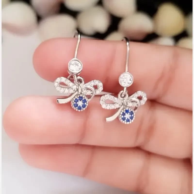 گوشواره نقره زنانه طرح پاپیون و چشم نظر عیار 925 روکش طلا سفید — تصویر ۷