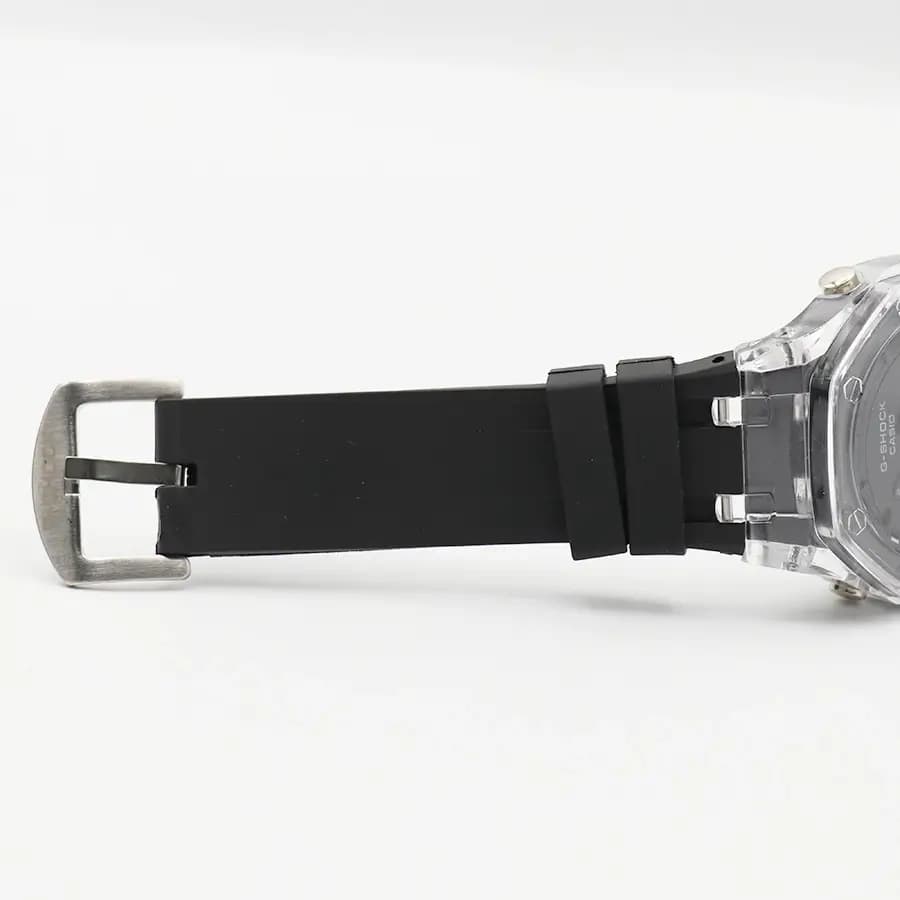 ساعت مردانه CASIO G-SHOCK قاب شفاف، صفحه مشکی آنالوگ و دیجیتال، بند سیلیکونی مشکی، قاب هشت‌ضلعی، نمایش تاریخ و روزهای هفته، موتور کوارتز دوزمانه، قفل سگکی پین‌دار مدل GA-2100 — تصویر ۷