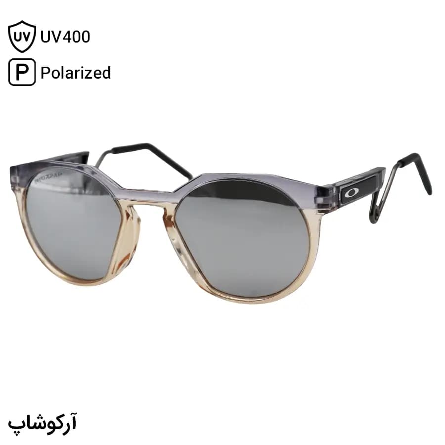 عینک ورزشی اوکلی با فریم گرد، رنگ بنفش و قهوه‌ای، دسته سنجاقی و لنز آینه‌ای نقره‌ای و پلاریزه مدل OO9279