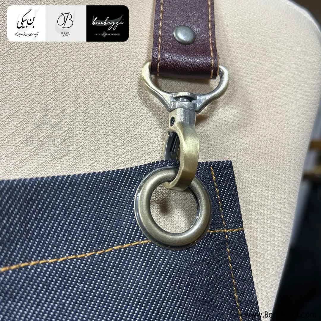 پیشبند کار زنانه لی و چرم پارچه جین پشت ضربدری پنج جیب یراق دار کد 27879 — تصویر ۴
