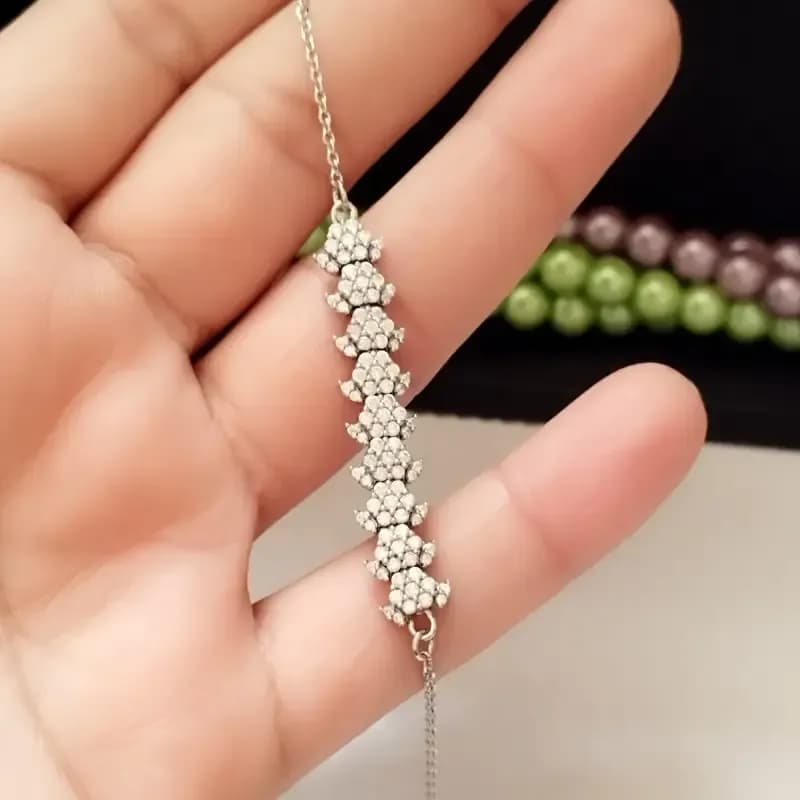 دستبند نقره زنانه عیار 925 طرح جواهری روکش طلا سفید وزن 4.49 گرم — تصویر ۱۲